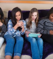 Group of kids on their mobile device