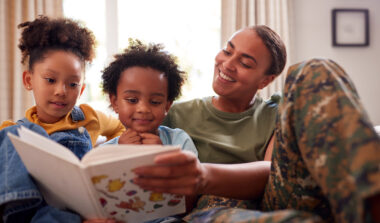 Military Service Member Reading to Kids