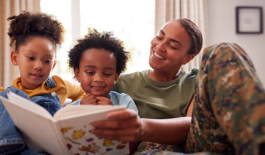 Military Service Member Reading to Kids