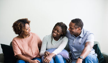 Military teen talking to parents at home