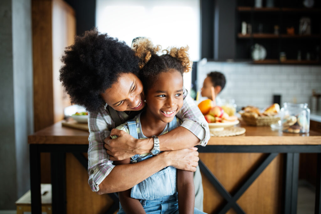 Military mom and daughter reintegration hug