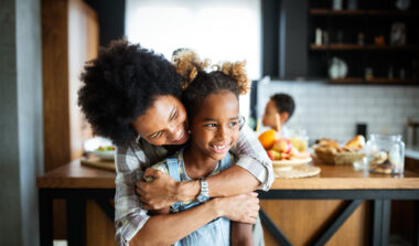 Military mom and daughter reintegration hug